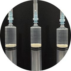 Extracted calcium deposit in syringe after the procedure